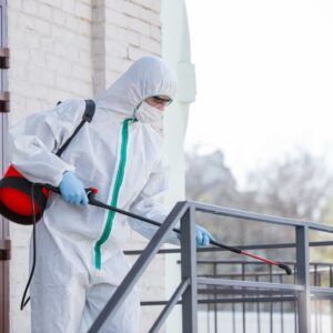 coronavirus-pandemic-disinfectant-protective-suit-mask-sprays-disinfectants-room_155003-4342